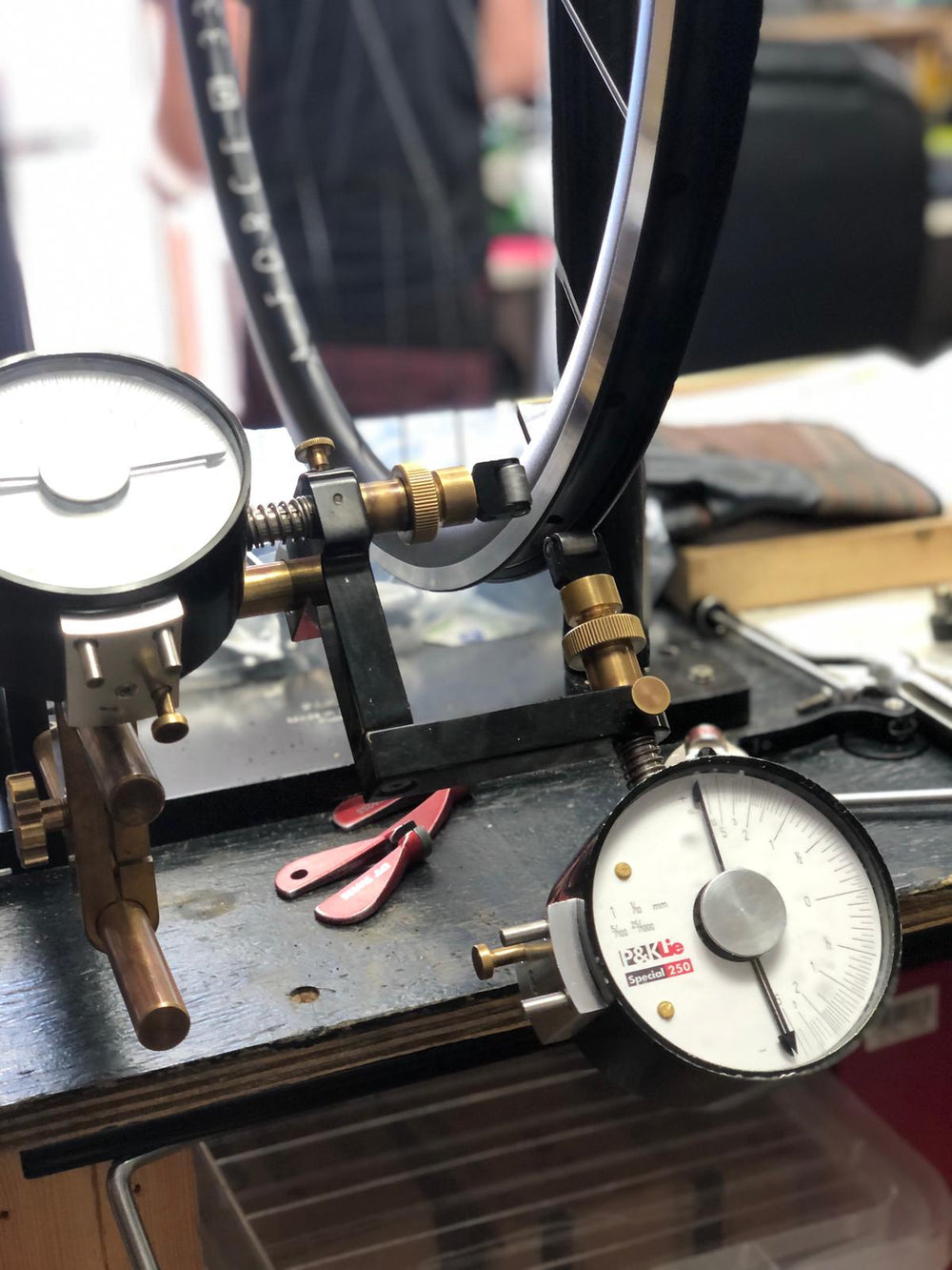 Wheel truing and spoke tension check